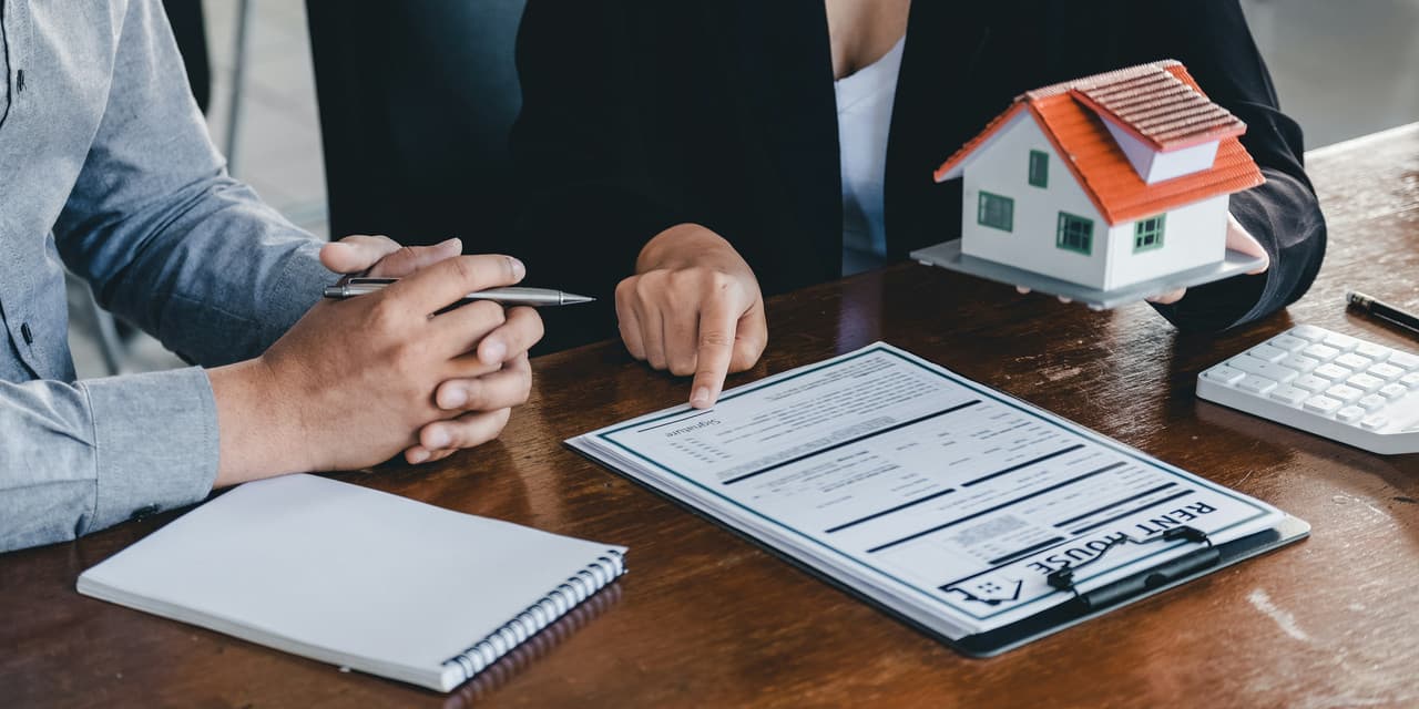 A person using a mortgage interest calculator on a laptop