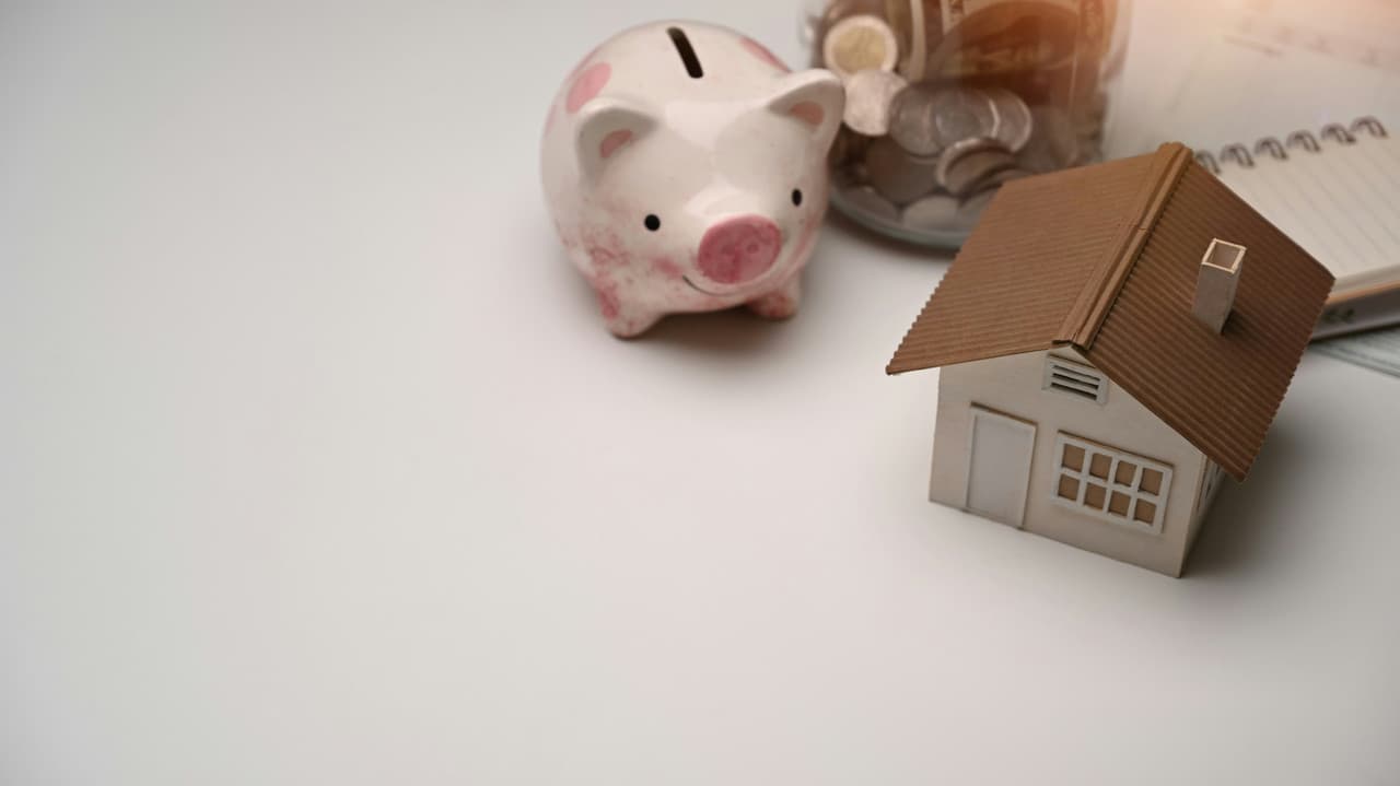 A person using a home loan calculator on a laptop